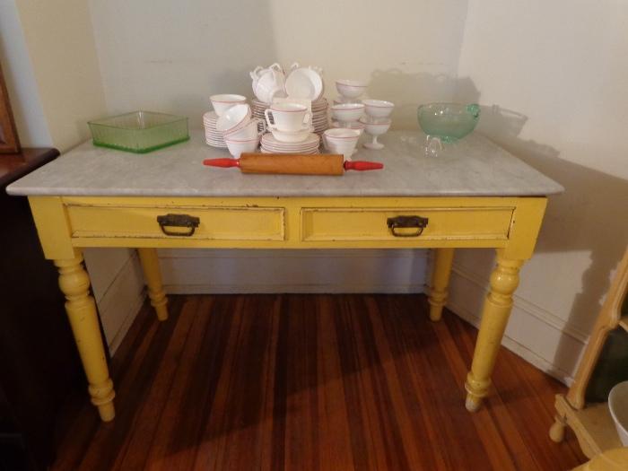 Lovely antique farm table with marble top.