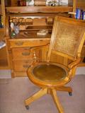Antique cylinder or barrel top desk with newer desk chair