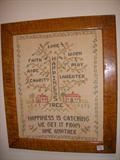 Needlework motto in great tiger maple frame
