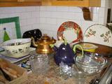 Kitchen dishware and serving pieces. Holly decorated charger is by Blue Ridge Pottery.