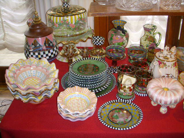 MacKenzie-Childs pottery and glassware.  Note the miniature tuffet that could double as a pin cushion in the lower right of the photo