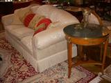 Sofa labeled "Klingman's" and Widdicomb marble top table (one of a pair)