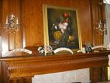 Mantle showing carved ivory, Asian stone carvings, and still life artwork