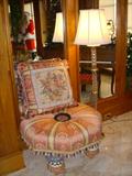 Tuffet and cushion by MacKenzie-Childs. Floor lamp is signed Waterford