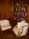 Swan arm chairs and books in corner of library/office