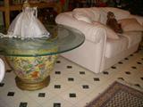 Chinese "fish bowl" with etched glass top, and pale pink leather loveseat