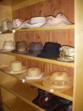 Men's hats in walk-in cedar closet in basement