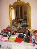 Small section of the purse display with a beautiful beveled mirror. Purses are labeled Gucci, Escada, Versace, Neiman-Marcus and others....