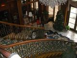 View looking down the grand staircase. Note the baby grand piano at the bottom of the stairs, to the left