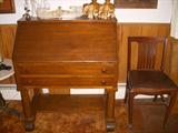 Mahogany Colonial Revival (Ca. 1910) drop-front mahogany desk with chair.  Has fitted interior.