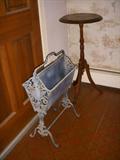 Another 1920's cast iron magazine rack along with another Victorian walnut stand