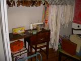 Sewing machine, Tablecloths on hangers, etc.