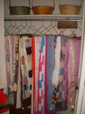 Closet full of quilts of various ages and patterns