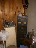 File cabinet, Bottles, In right foreground is a selection of milk bottles