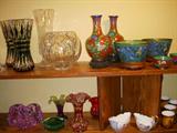 Top Shelf (L to R).  Pair of green cut-to-clear Val St. Lambert vases, Cut glass rose bowl, Lead crystal vase, Cloisonné vases and bowls.  Bottom shelf: Art glass bowls and vases, Creamer & sugar, part of Warwick Monk set