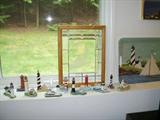 Lighthouse figurines, tray and window with etched lighthouse pattern in central pane
