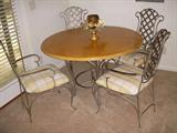 Wood top table with metal base and metal frame chairs