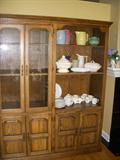 Oak cabinet with glass doors on the left side, and open shelves on the right