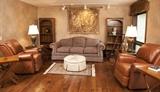 Sherrill Furniture couch, 2 tan Pleather recliner rockers, small bookshelves, end tables, lamps, ottoman, 3'3 x 4'7 rug