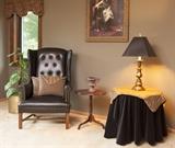 Black PLeather chair (some damage) small table, lamp.