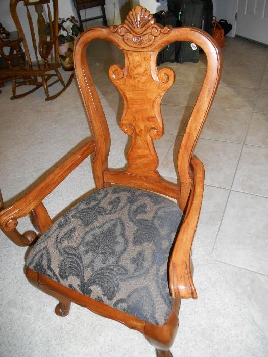 One of the Captains Chairs for the formal dining room table and chairs set. This set is heavy, well made, detail galore, and the burlwood is just breathtaking.