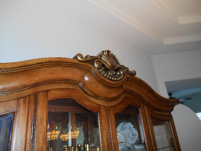 Detail at the crest of the china cabinet