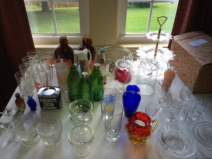 Tables and tables of glassware for sale. Antique bottles, full dish sets etc.