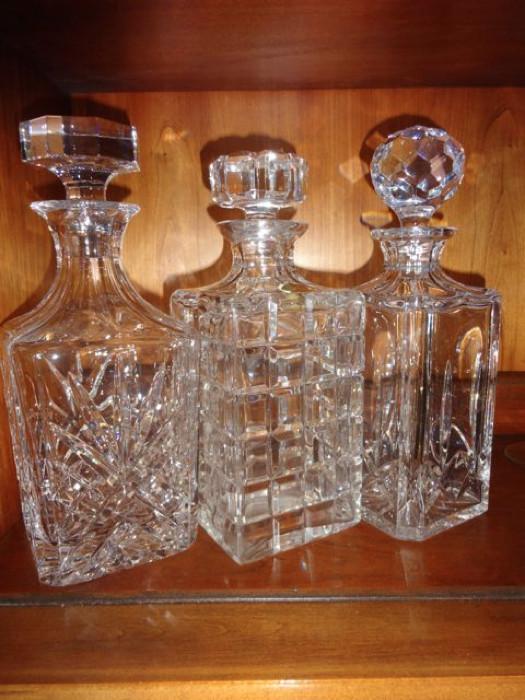 A trio of crystal decanters.