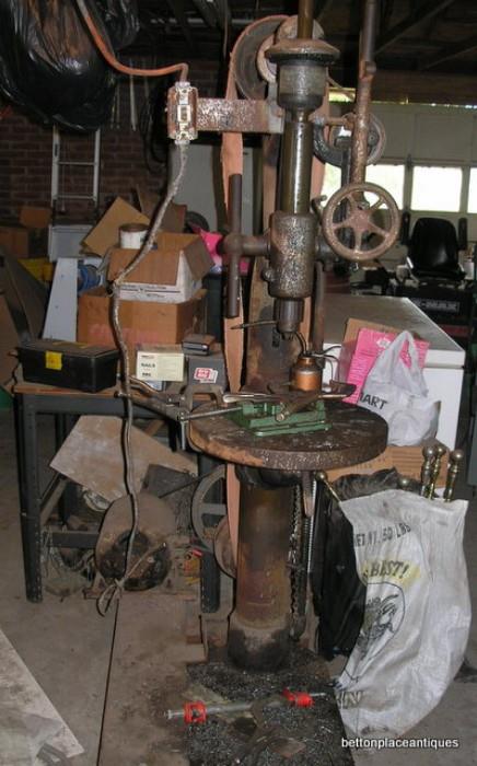 Very old working Drill Press with belts and it has its own motor