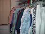 Closet full of ladies casual clothing, handbags, clutches, wallets, shoes etc.