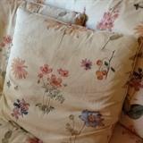 Close up of  floral pattern on sofa and throw pillows