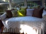 Cute day bed and lots of throw pillows