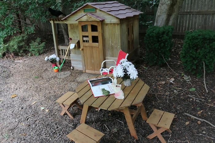 Handmade child's wooden playhouse, picnic table and chairs (umbrella not shown)