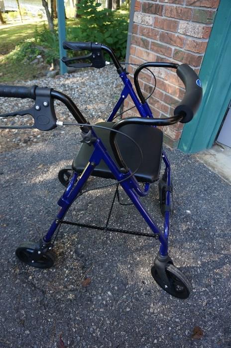 Invacare walker in mint condition with seat and brakes
