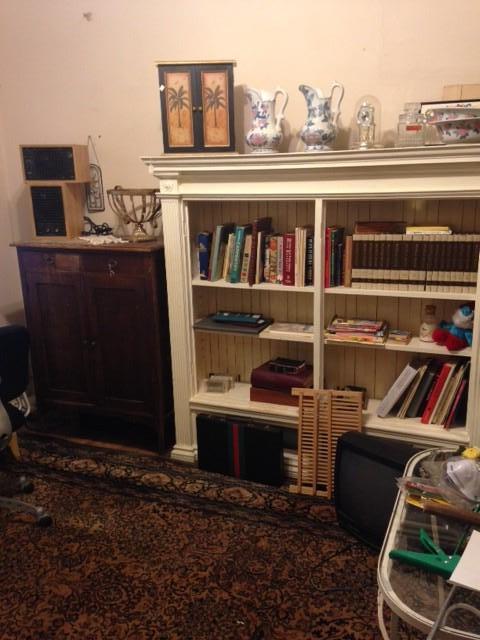 Antique cabinet and beautiful white bookshelf. Antique rug. Second floor.