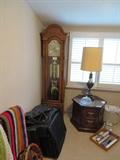 grandfather clock, end table, lamp, luggage
