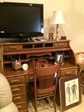    Flat screen TV; roll top desk; antique desk chair