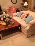      Sofa; decorative pillows; square coffee table