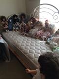                   Iron day bed; variety of dolls;