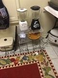       Many small appliances; fruit bordered rug;