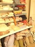           Lots of bedding, pillows, & table linens; 