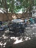 Black round patio table/4 chairs; other outdoor items.