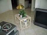 Rattan side table with woven top.  Art Deco style brass finish lamp (2 in the house)