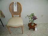Ladies boudoir chair or bedside chair with Chinese style plant stand on floor