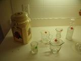 Coffee jar and various glass items in kitchen