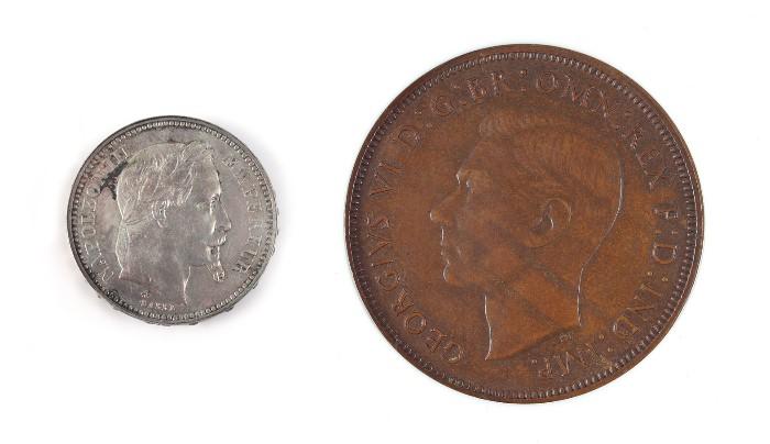 1003) Rare George VI Double Obverse Penny, NGC MS62; 1004) 1865-A Silver 20 Franc Off-Metal Trail Coin, stamped Champney 