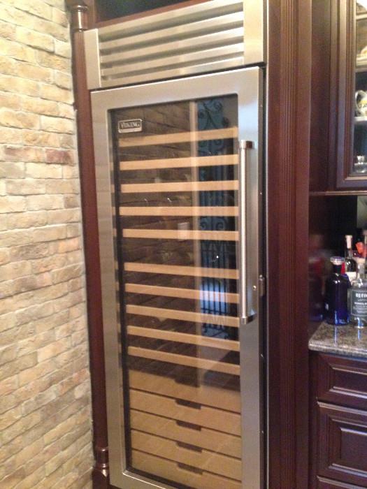 Viking VCWB 301 RSS wine cooler measures aprox 29x 83.     Holds aprox 150 bottles