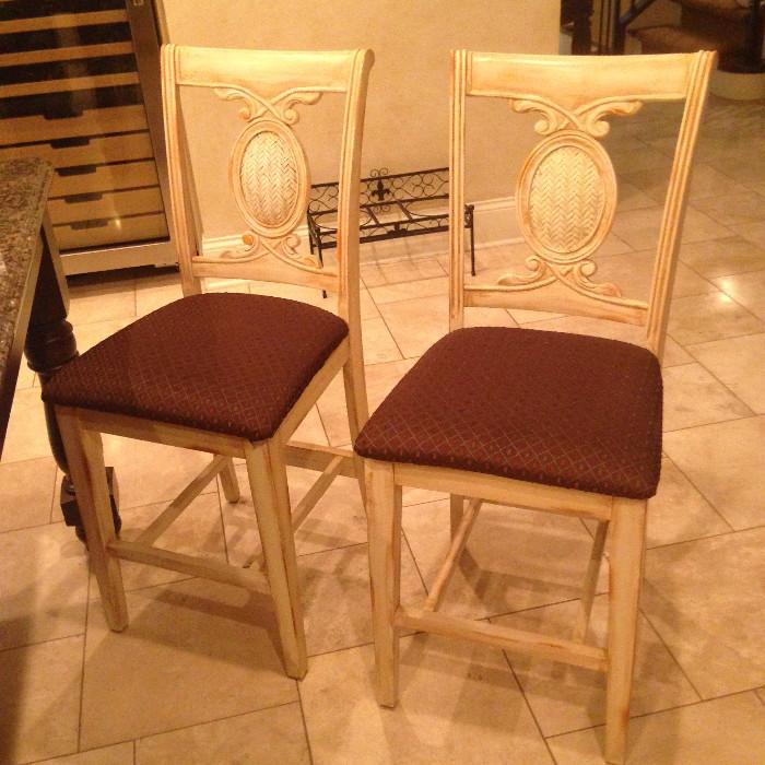 Set of 8 counter height chairs in a lovely blond wood with coordinating upholstery
