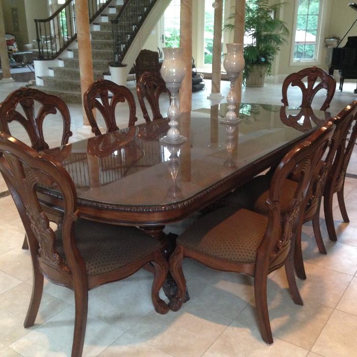 Lovely Bernhardt dining table with glass top and 8 coordinating chairs.