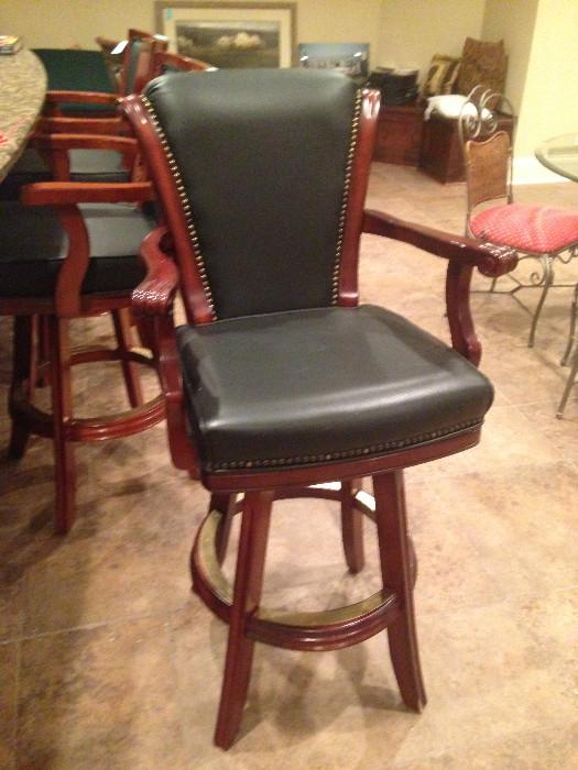 Set of 4 bar stools in black leather. Like new condition